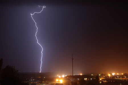 lightning strike the city at night