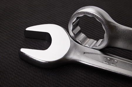 wrenches on a dark textured backgroundの写真素材