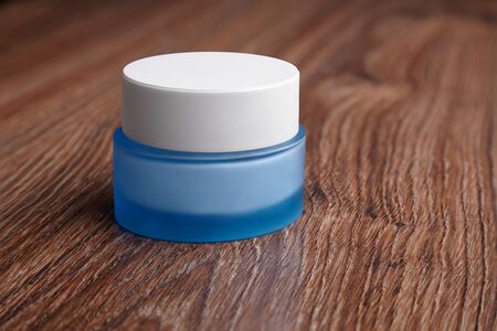 blue glass jar with cream, cosmetic, body careの写真素材