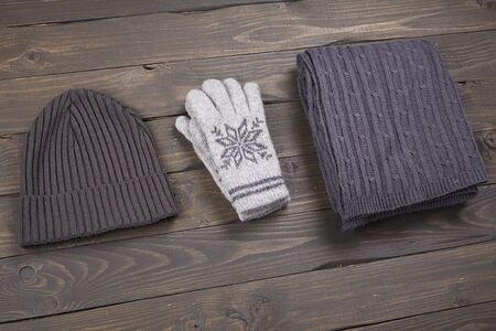 layout warm clothes top view, on a wooden boardの写真素材