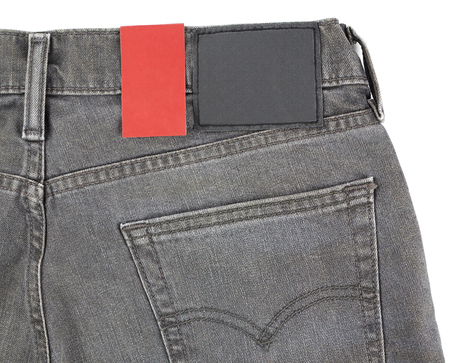 Paper tag on jeans, branded label on new pantsの写真素材
