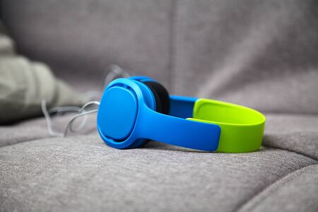 place to relax, relax with music headphones on a textile sofa