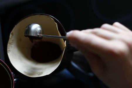 Point of view  of male hands that prepare a delicious coffeeの写真素材