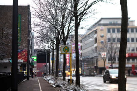 road in winter with bus stopの写真素材