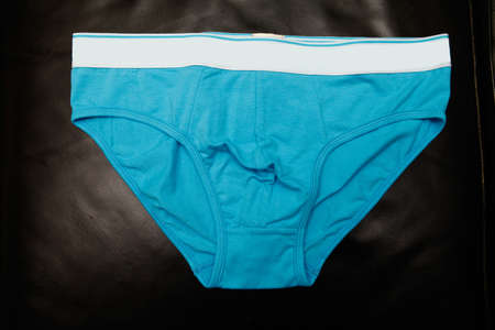 blue underpants for men on black background, isolatedの写真素材