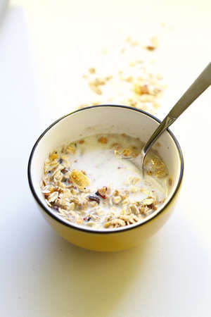 Mussli in a small yellow bowl