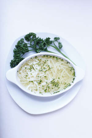 Delicious wedding soup in a white plate from above isolatedの写真素材