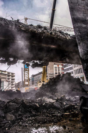 An old bridge is demolished by a excavator