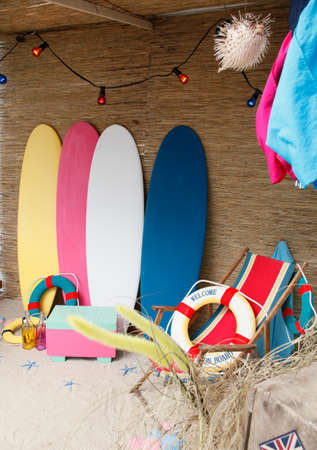 colorful surfboards standing in the sandの写真素材