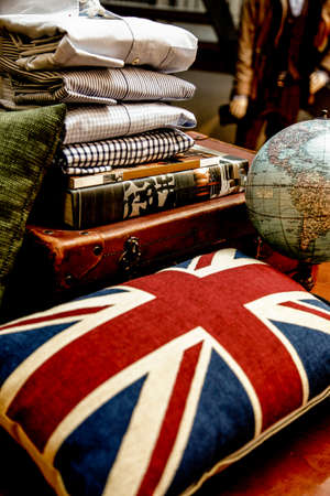pillow with union jack pattern. Still life of old books in the backgroundの写真素材