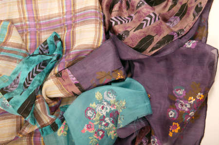 Still life of colorful scarves, draped on table, isolated neckerchief, Women Accessories