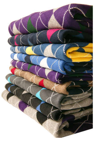 many colorful sweaters in a row.Still life of clothes, stack of sweater