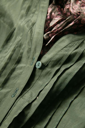 Colorful pieces of fabric are stacked on the floorの写真素材