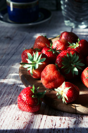 Fresh strawberries on a rustic wooden table. Selective focus.の写真素材