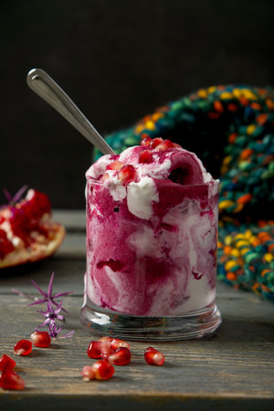 ice cream with pomegranate seeds in a glass, selective focusの写真素材