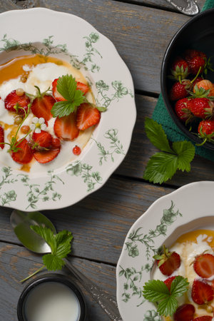 Pancakes with strawberries and whipped cream on a wooden background.の写真素材
