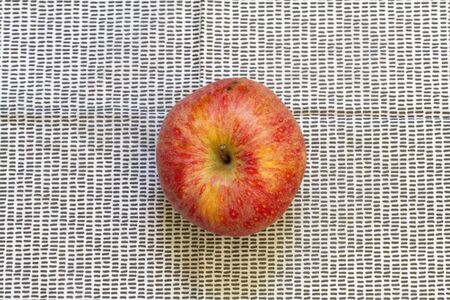 A red delicious apple on a black background and whiteの写真素材