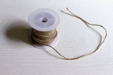 Thin rope coil for packaging on a neutral background