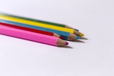Wooden pencils with vibrant colors on white backgroundの写真素材