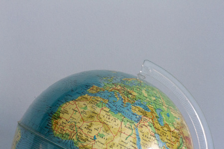 Detail of a globe on neutral backgroundの写真素材