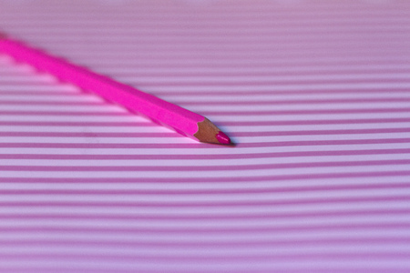 Wooden pencil to draw on stamped backgroundの写真素材