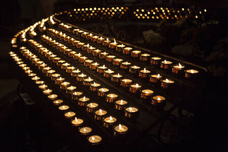 Burning votive candles in the churchの写真素材