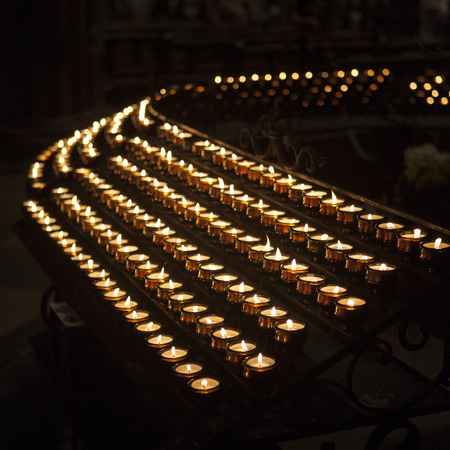 Burning votive candles in the churchの写真素材