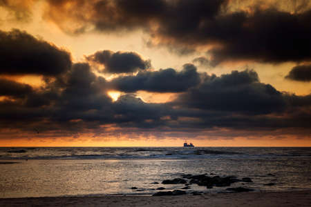 North Sea, sunset - dramatic and moody skyの写真素材