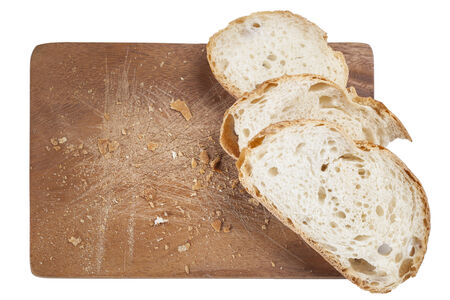 Slice of white bread on a wooden boardの写真素材