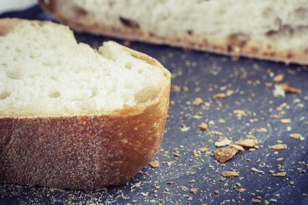 Slice of white bread on a plate of schist