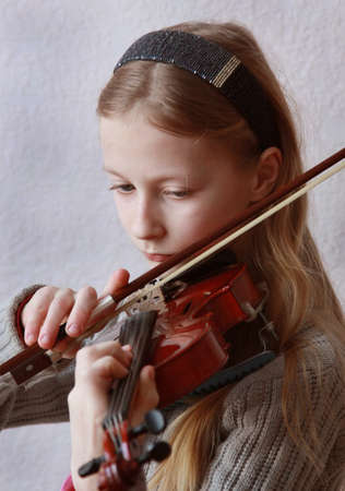 The girl plays a violinの写真素材