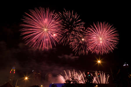 All colors of a rainbow in the sky from bright salutesの写真素材