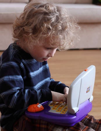Little boy looking at PC