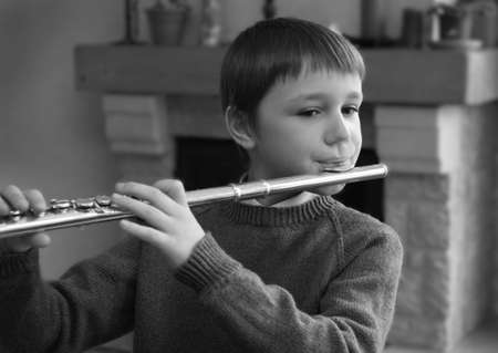 boy playing the fluteの写真素材