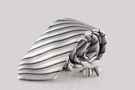 cross tie with cuff links on white backgroundの写真素材