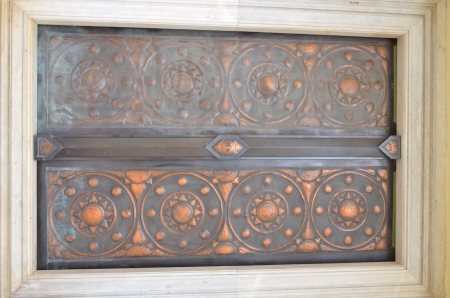 Brown door with a white border.の写真素材