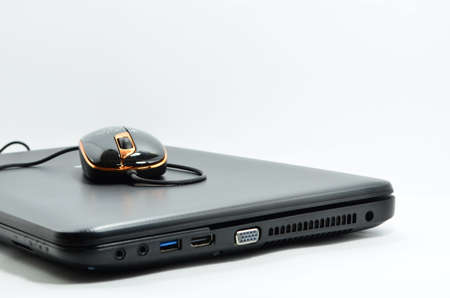 Notebook computer mouse on a white background の写真素材