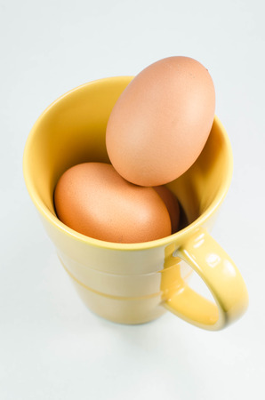 Images within an egg in a glass of coffee  の写真素材