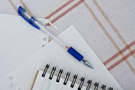 a pen on a spiral notebook.の写真素材