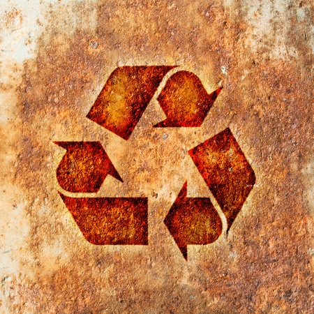 Recycling symbol on the metal surface rustの写真素材