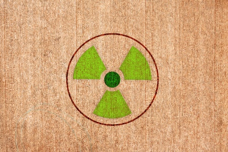 radioactivity warning symbol on wood backgroundの写真素材