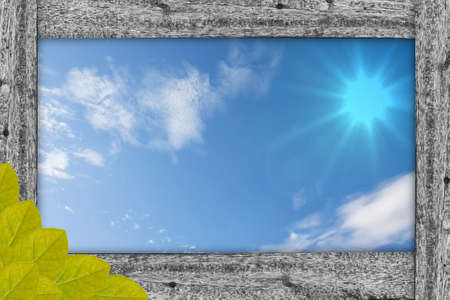wood frame on blue sky backgroundの写真素材