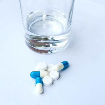 Glass of water and pillsの写真素材