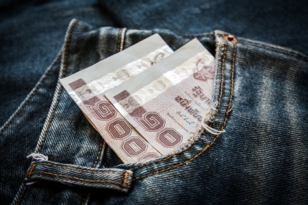 Thailand money in the pocket of his jeans の写真素材
