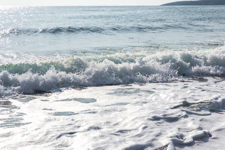 seawater with sea foam and wavesの写真素材