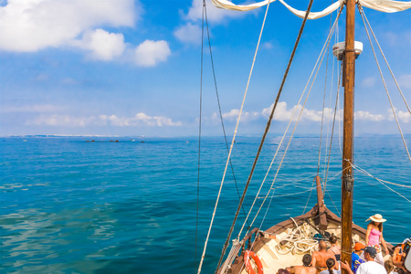 masts of sailing ships lying at the wharf skyline, blue sky with cloudsのeditorial素材