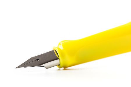 yellow modern fountain pen isolated on white, close upの写真素材