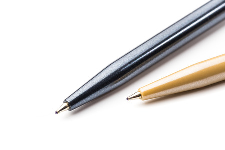 pair of two ballpoint pens isolated on white background, close upの写真素材