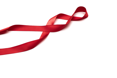 red satin ribbon isolated on white backgrounの写真素材