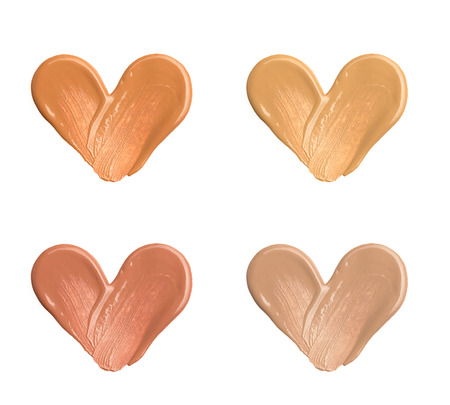 Smears of foundation for face.A smear of lipstick. Cosmetic smear of liquid. Isolated on white backgroundの写真素材